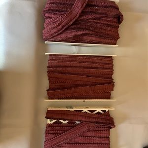 Decorating fringe.  Maroon in color.